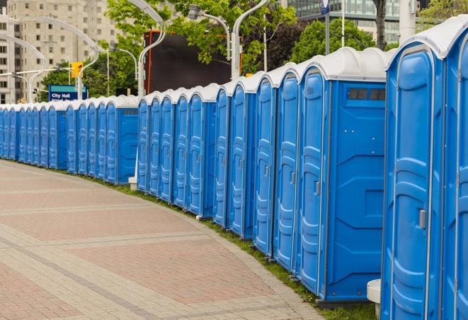 a row of portable restrooms set up for a special event, providing guests with a comfortable and sanitary option in Chesapeake